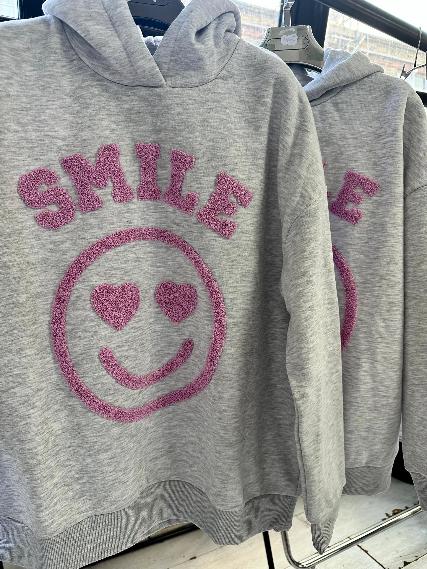 SMILE FLEECE LINED EMBOSSED HOODIE